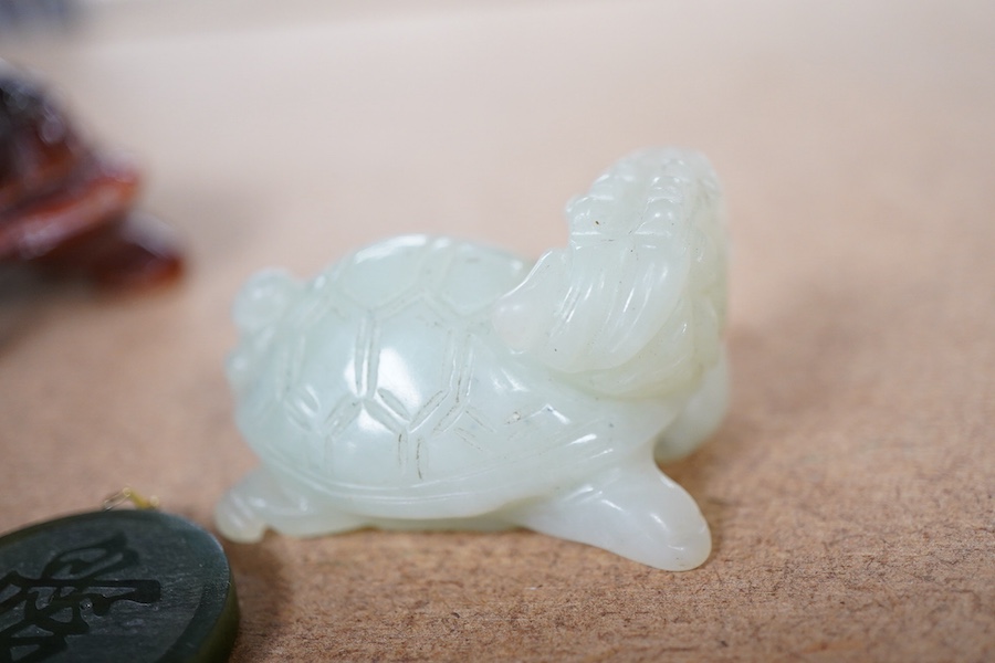 A Chinese carved jade pendant and two hardstone carved animals, pendant 3cm diameter.
